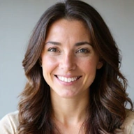 Professional headshot of a friendly and approachable female dietitian, smiling warmly.